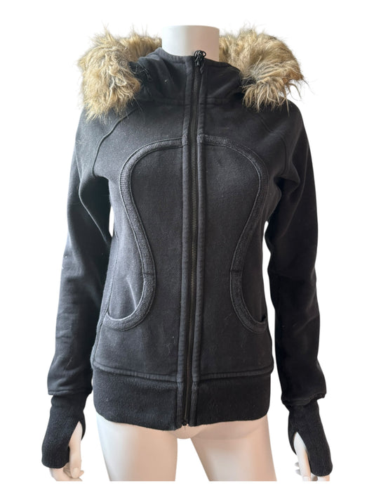 Black jacket with fur-lined hood on a mannequin against a white background