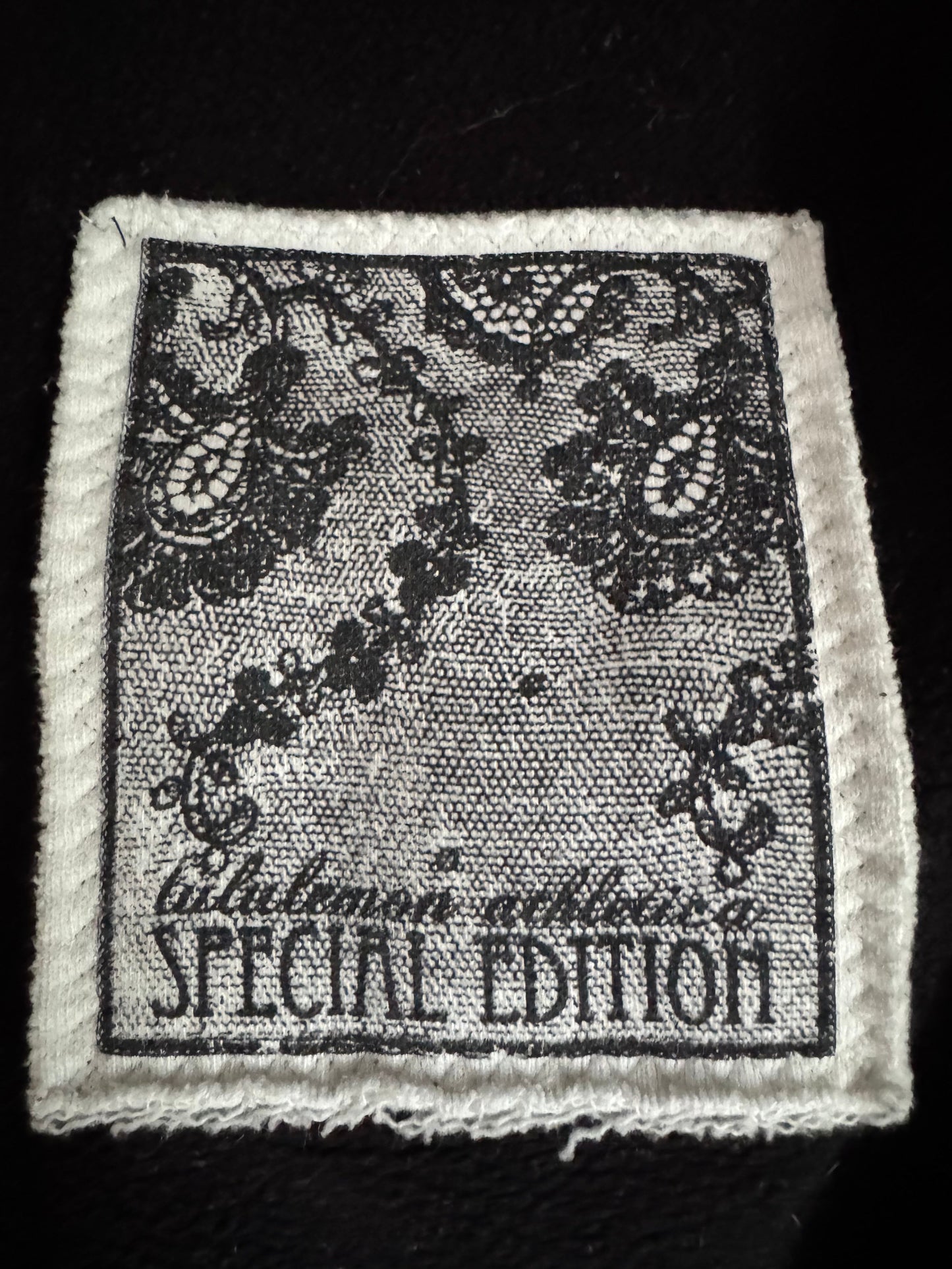 Textile patch with floral design and 'Special Edition' text on a black background