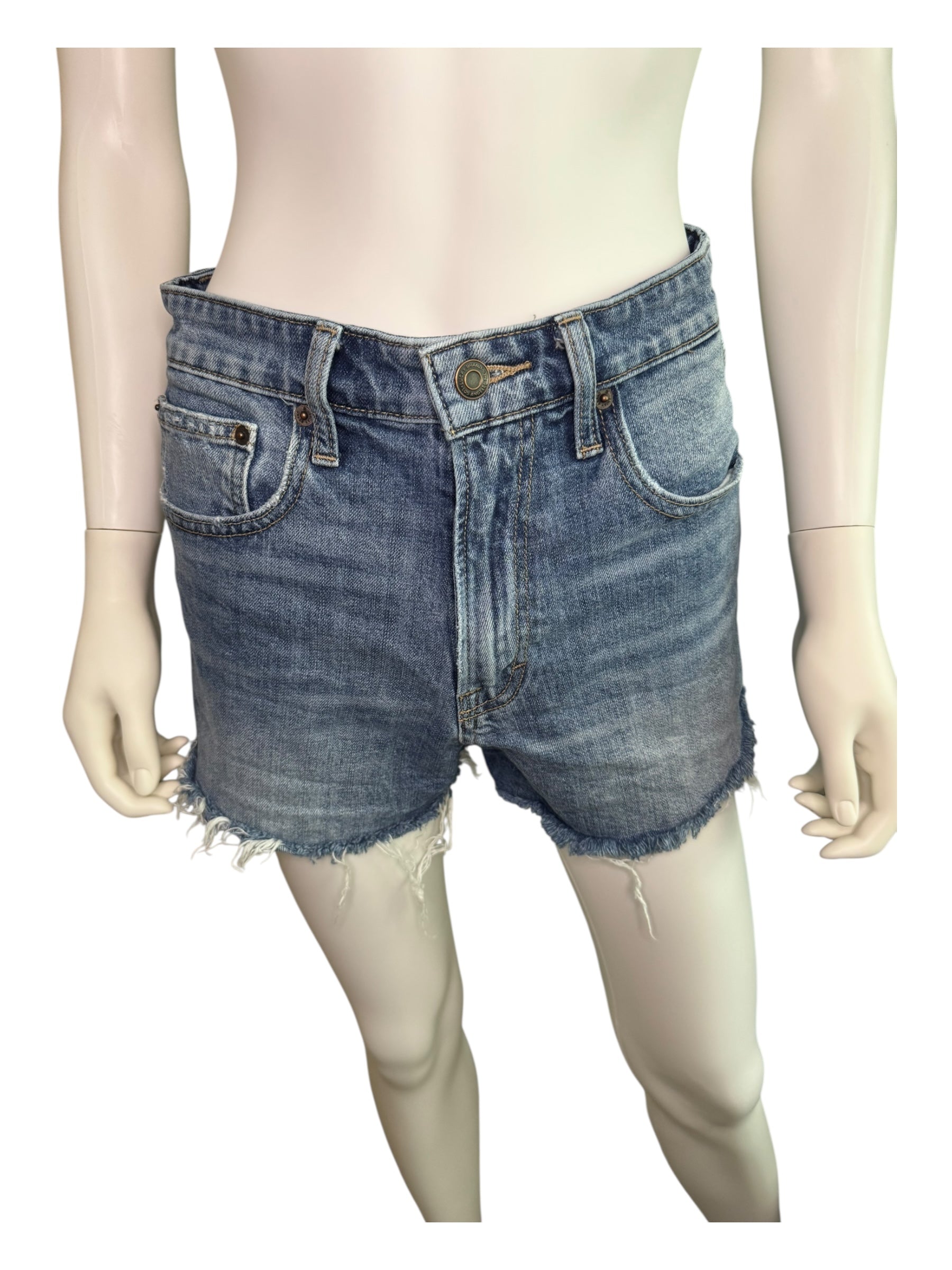 Denim shorts on a mannequin against a white background
