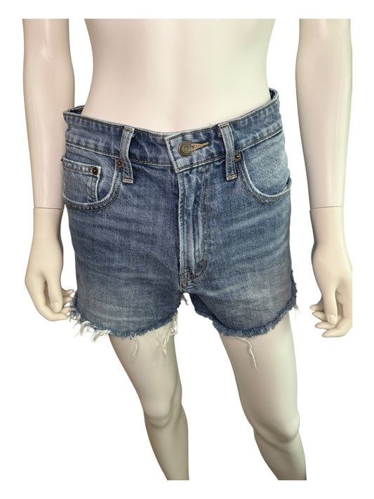 Denim shorts on a mannequin against a white background
